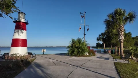 Grantham Point in Mount Dora, Florida red and white lighthouse Stock Footage 309019391