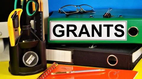 Grants. Text label in the folder. Stock Photos