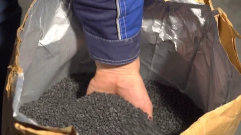 Granular carbon in a bag Stock Footage 83366166