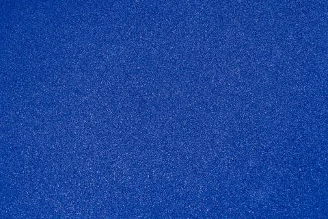 Granular dark blue texture forms detailed close up surface background Stock Illustration