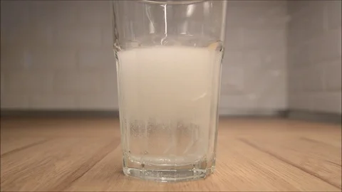 Granular effervescent effect in contact with water Stock Footage 86651773