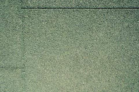 Granular green rubber crumb surface texture close up Stock Photos