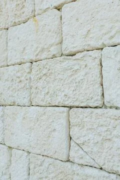 Granular limestone with sharp edges. Fine textured limestone block with poi.. Stock Photos