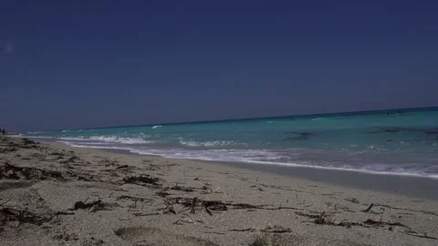 A granular sand that is truly beautiful. The waves come and go continuously Stock Footage 305132858