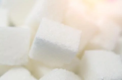 Granulated sugar cubes Stock-Fotos