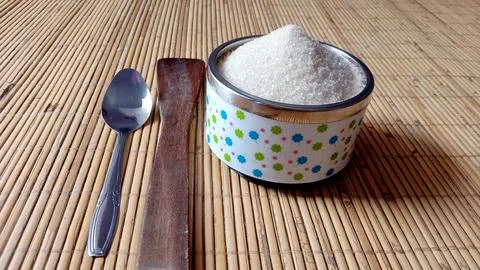 Granulated sugar with two different spoons Stock Photos