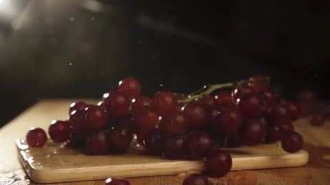 Grape branch falls with water drops slow motion Stock Footage 211767146