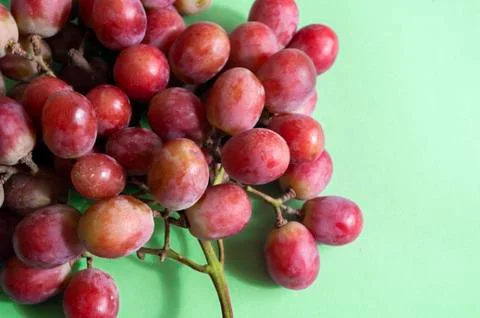 Grape bunch close up, fresh fruit photo. green background Stock Photos