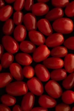 Grape / cherry red tomato macro close up Stock Photos