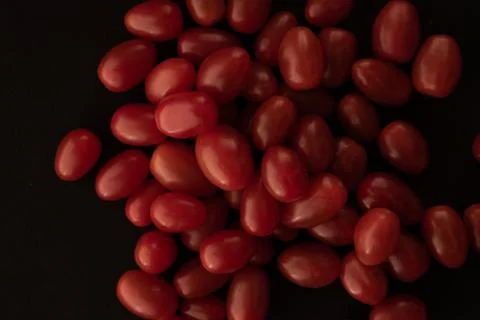 Grape / cherry red tomato macro close up Stock Photos