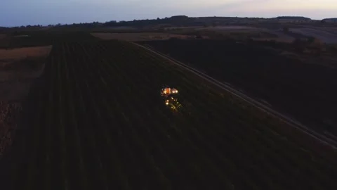 Grape harvester combine machine autumn night time morning dawn dark low light Stock-Footage 163735583