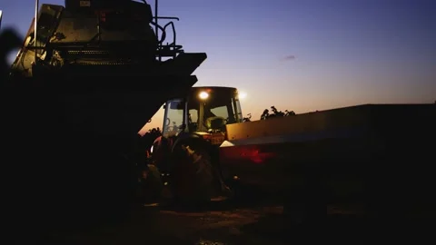 Grape harvester combine machine night time morning dawn dark low light 스톡 동영상 163735133