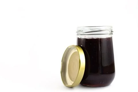 Grape jam isolated on white background. Stock Photos