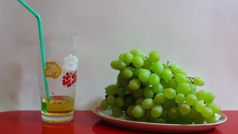 Grape juice is being poured Stock Footage 106701879