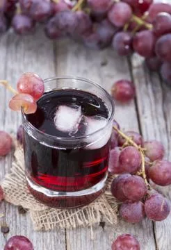 Grape juice with ice Stock Photos