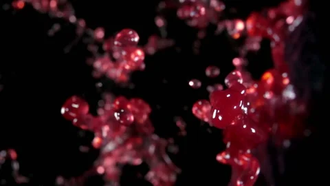 Grape juice, red wine bouncing against to the camera Stock Footage 88492860