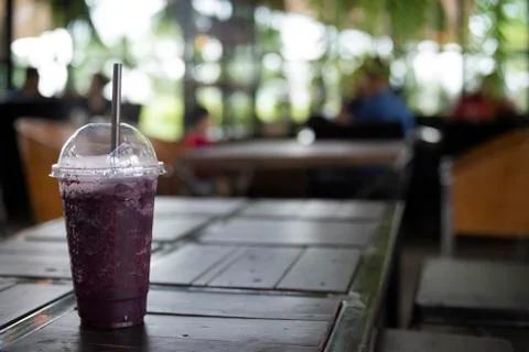 Grape juice on table blurred background Stock Photos