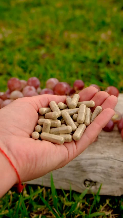 Grape seed extract in the garden. Selective focus. Stock Footage 320824219