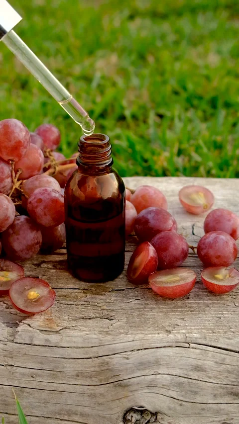 Grape seed extract in the garden. Selective focus. Stock Footage 320824684