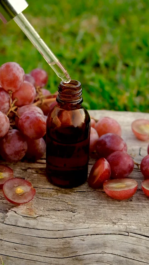 Grape seed extract in the garden. Selective focus. Stock Footage 320899706