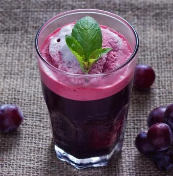 Grape smoothie on sack background Fotos Stock
