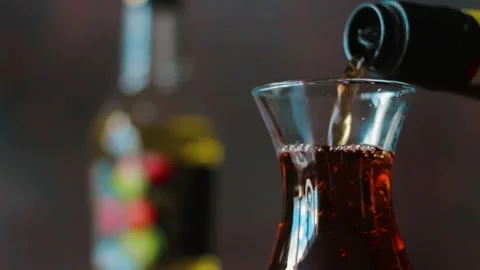 Grape vinegar is placed in a small glass. Stock Footage 249813101