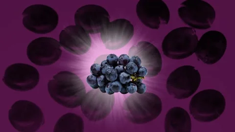 Grape on a yellow background. Rays of light. Video stock 217005427