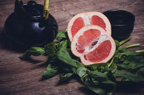 Grapefruit and basil tea served in cup 스톡 사진