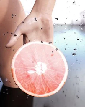 Grapefruit and female hand Stock Illustration
