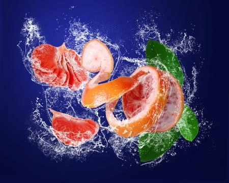Grapefruit  and segments  in water splashes Stock Photos