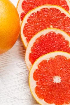 Grapefruit and slices 스톡 사진