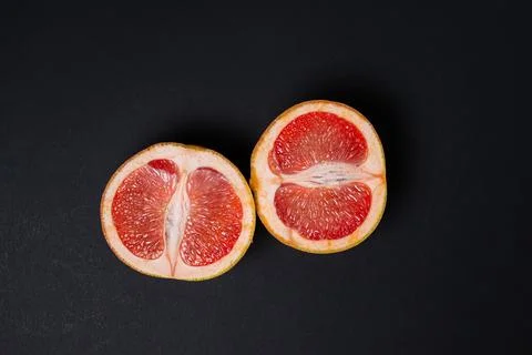 Grapefruit on a black background.  Stock Photos