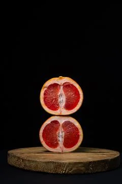 Grapefruit on a black background.  Stock Photos