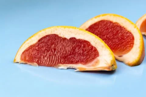 Grapefruit on a blue table Stock Photos