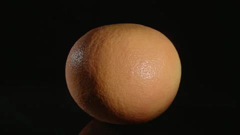 Grapefruit close-up on a black background. Video stock 147097991