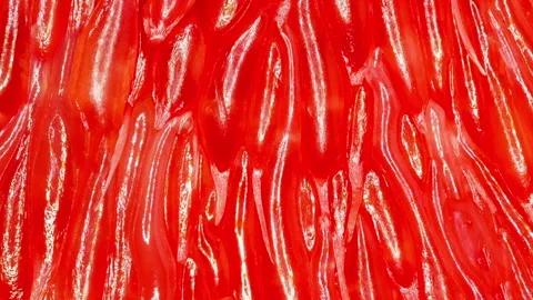 Grapefruit close-up, peeled surface slices, red citrus fruit,  rotating, turning 스톡 동영상 240656220