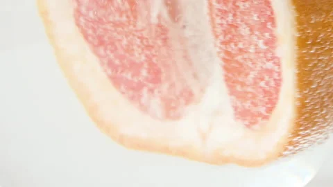 Grapefruit close-up sizzles or floats to the surface. Halves of pink grapefruit Stock Footage 195812690