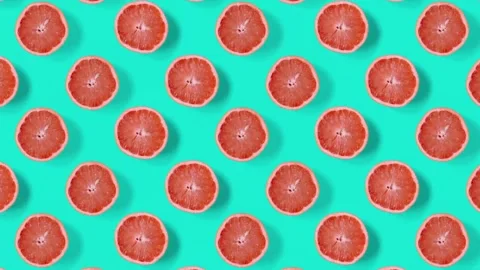 Grapefruit dancing top view. Cyan retro background. Stop motion animation. Stock Footage 135417787
