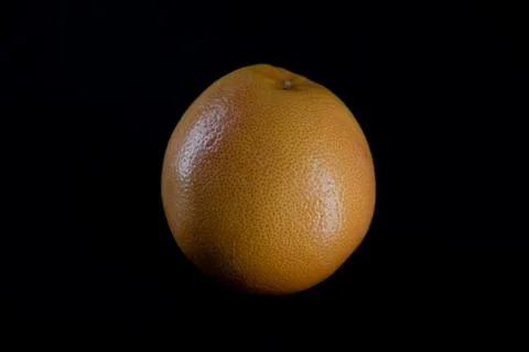 Grapefruit on a dark background Stock Photos