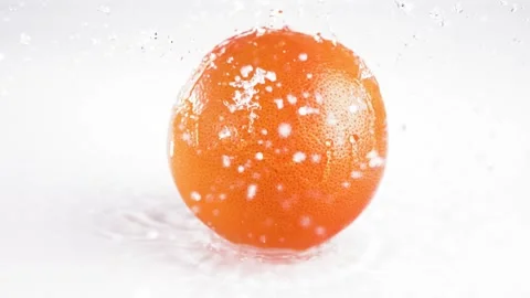 Grapefruit Falls Off The Horizontal Surface Water Splash，Slow Motion Video stock 248405773