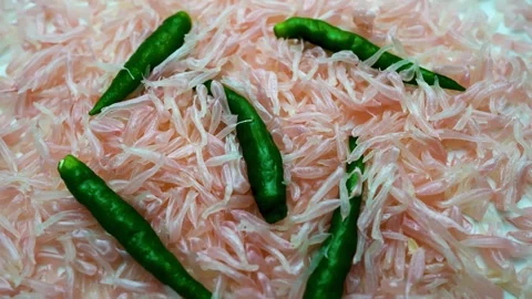 Grapefruit grains and green chilli pepper slide view on white table Stock Footage 282848402
