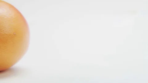 Grapefruit Halves Moving From Left to Right Stock Footage 70682794