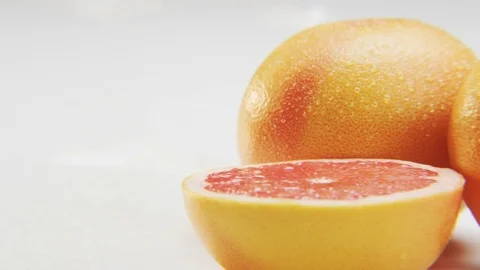 Grapefruit Halves Moving From Right to Left Stock Footage 70681430