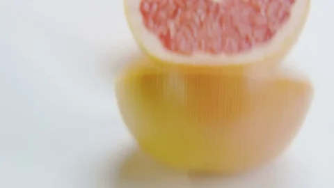 Grapefruit Halves on White Background Stock Footage 70216649