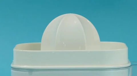 Grapefruit juicing and squeezing close up, 4k Stock Footage 60777323