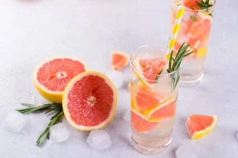 Grapefruit lemonade. Two glasses of refreshing drink, water with  grapefruit, Stock Photos