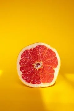 Grapefruit on orange background Stock Photos
