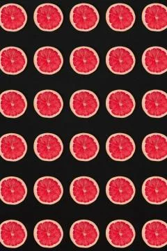 Grapefruit pattern isolated on black background. Flat lay Stock Photos