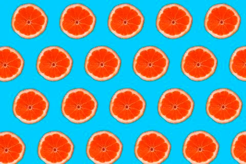 Grapefruit pattern isolated on blue background. Flat lay 写真素材