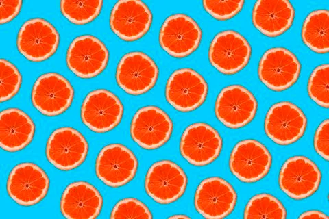 Grapefruit pattern isolated on blue background. Flat lay 写真素材